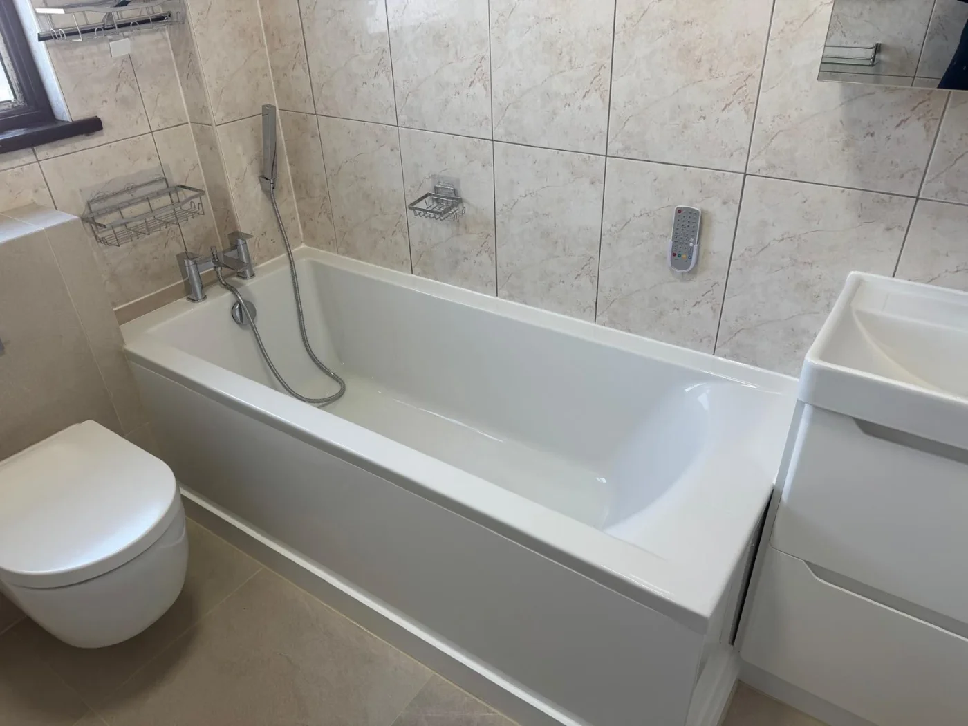 Finished family bathroom with bath, basin and toilet